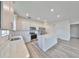 Modern kitchen with hardwood floors, stainless steel appliances, and a center island perfect for cooking at 36959 Highland Meadows Ct, Zephyrhills, FL 33542