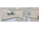 Open living room with hardwood floors, recessed lighting, and ample natural light from multiple windows at 36959 Highland Meadows Ct, Zephyrhills, FL 33542