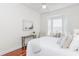 Inviting bedroom featuring a bay window, hardwood floors, and a tranquil ambiance at 3964 Silk Oak Ln, Palm Harbor, FL 34685