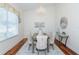 Comfortable dining room with stylish decor and ample natural light creates an inviting space at 3964 Silk Oak Ln, Palm Harbor, FL 34685
