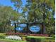 Lansbrook Golf Club and Tarpon Lake Villages sign, showcasing nearby amenities and community features at 3964 Silk Oak Ln, Palm Harbor, FL 34685
