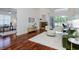 Spacious living room with a fireplace, comfortable seating, and natural light at 3964 Silk Oak Ln, Palm Harbor, FL 34685