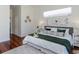 Bright bedroom with hardwood floors, a large window, and neutral decor at 3964 Silk Oak Ln, Palm Harbor, FL 34685