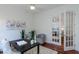 Bright office space featuring a desk, chair, accent chairs, and french doors at 3964 Silk Oak Ln, Palm Harbor, FL 34685
