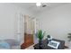 Bright office space featuring a desk, chair, accent chairs, and french doors at 3964 Silk Oak Ln, Palm Harbor, FL 34685