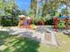 Community playground with colorful play structures, slides, swings, and shaded picnic area for Gathering fun at 3964 Silk Oak Ln, Palm Harbor, FL 34685