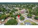 Aerial view showing the home's location within a vibrant neighborhood and landscaping at 402 Merlin Ct, Brandon, FL 33510