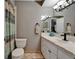 Comfortable bathroom featuring a single sink vanity and a patterned shower curtain at 402 Merlin Ct, Brandon, FL 33510