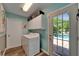 Bright laundry room with a view to the pool at 402 Merlin Ct, Brandon, FL 33510