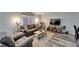 Comfortable living room with wood floors, neutral paint, and plenty of seating at 402 Merlin Ct, Brandon, FL 33510
