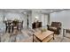 Comfortable living room with wood floors, furniture set, dining table, and charming decor at 402 Merlin Ct, Brandon, FL 33510
