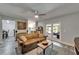 Bright living area with view into kitchen and outdoor patio with modern sliding glass doors at 402 Merlin Ct, Brandon, FL 33510