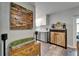 Hallway area with wood floors, decorative woodworking art, access to the kitchen, and modern design at 402 Merlin Ct, Brandon, FL 33510