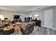 Open living area featuring wood floors and a smooth transition to the dining room at 402 Merlin Ct, Brandon, FL 33510
