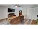 Cozy living area with a large television, modern furniture, and neutral tones creating a warm ambiance at 402 Merlin Ct, Brandon, FL 33510