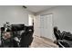 Spacious home office featuring computer setups, gaming chairs, and closet storage at 402 Merlin Ct, Brandon, FL 33510
