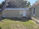 Exterior view of the back of the house, showing the siding and access door at 4420 6Th S Ave, St Petersburg, FL 33711