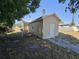 A view of the side of the house, showing the yard and the side access entrance at 4420 6Th S Ave, St Petersburg, FL 33711