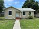 Charming single-story home featuring a cozy front porch and walkway at 4420 6Th S Ave, St Petersburg, FL 33711