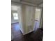 A hallway features an enclosed closet with an AC vent and archways, providing seamless transitions between rooms at 4420 6Th S Ave, St Petersburg, FL 33711