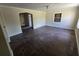 Open living room with hardwood floors, arched doorway, and neutral wall paint at 4420 6Th S Ave, St Petersburg, FL 33711