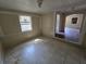 Tile floor room featuring light walls, one window and view to living room at 4420 6Th S Ave, St Petersburg, FL 33711