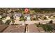 Picture of a lovely home in a vibrant neighborhood with well-manicured lawns and palm trees at 443 Noble Faire Dr, Sun City Center, FL 33573