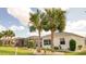 Lush backyard with screened lanai and tropical landscaping for outdoor enjoyment and privacy at 443 Noble Faire Dr, Sun City Center, FL 33573