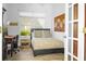 Bright bedroom featuring a desk and bed near a window offering natural light at 443 Noble Faire Dr, Sun City Center, FL 33573