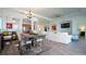 Spacious living space with a combined dining and living area, perfect for gatherings at 443 Noble Faire Dr, Sun City Center, FL 33573