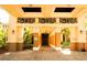 Grand entrance with ornate columns, manicured landscaping, and elegant details creating an inviting approach at 443 Noble Faire Dr, Sun City Center, FL 33573