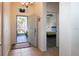 Inviting foyer with tile flooring, an open doorway, and a view of a bedroom, enhancing the home's appeal at 443 Noble Faire Dr, Sun City Center, FL 33573
