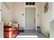 Welcoming front porch with a cozy bench, decorative accents, and a stylish front door for a charming entrance at 443 Noble Faire Dr, Sun City Center, FL 33573