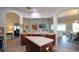 Open kitchen featuring a functional island, warm wood cabinetry, and seamless integration with adjacent living areas at 443 Noble Faire Dr, Sun City Center, FL 33573