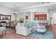 Open-concept living space with bright light from windows combining living room and dining area at 443 Noble Faire Dr, Sun City Center, FL 33573