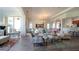 Inviting living space with an open layout, hardwood floors, and modern furnishings at 443 Noble Faire Dr, Sun City Center, FL 33573
