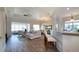 Bright and airy living space featuring open layout, hardwood floors, and plenty of natural light at 443 Noble Faire Dr, Sun City Center, FL 33573