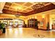 Expansive lobby with decorative lighting, high ceilings, and elegant decor, creating a luxurious atmosphere at 443 Noble Faire Dr, Sun City Center, FL 33573