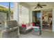 Inviting outdoor patio with a grill, seating, and view into the dining area at 443 Noble Faire Dr, Sun City Center, FL 33573