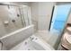 Bathroom featuring a soaking tub, tile shower, and double vanity sinks at 4456 Globe Thistle Dr, Tampa, FL 33619