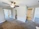 Carpeted bedroom featuring multiple entryways and a bathroom at 4456 Globe Thistle Dr, Tampa, FL 33619