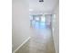 Home entryway showcasing tile flooring and open floor plan with combined living, dining and kitchen area at 4456 Globe Thistle Dr, Tampa, FL 33619