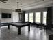 Community game room featuring a billiard table, TV, and seating at 4456 Globe Thistle Dr, Tampa, FL 33619