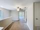 Open hallway with carpet flooring leading to other rooms in the home at 4456 Globe Thistle Dr, Tampa, FL 33619