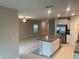 Open-concept kitchen featuring granite countertops, stainless steel appliances, and tiled flooring at 4456 Globe Thistle Dr, Tampa, FL 33619