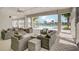 Comfortable outdoor lounge area with wicker furniture and a view of the pool at 4456 Globe Thistle Dr, Tampa, FL 33619