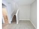 Interior shot of staircase featuring tile flooring, white trim, and neutral colored walls at 4456 Globe Thistle Dr, Tampa, FL 33619