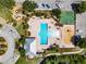 Aerial view of the community amenities including a pool, playground, basketball court, and ample parking at 4516 Savannah Holly Pl, Riverview, FL 33578