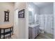 Well-lit bathroom showcasing stylish fixtures and a shower-tub combination at 4516 Savannah Holly Pl, Riverview, FL 33578