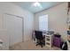 Bright bedroom with neutral carpet, white walls, closet and a window providing ample natural light at 4516 Savannah Holly Pl, Riverview, FL 33578